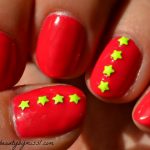 pink nails with yellow stars