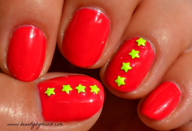 pink nails with yellow stars