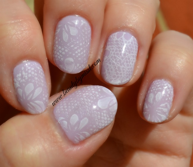 white and pastel lilac lace nails