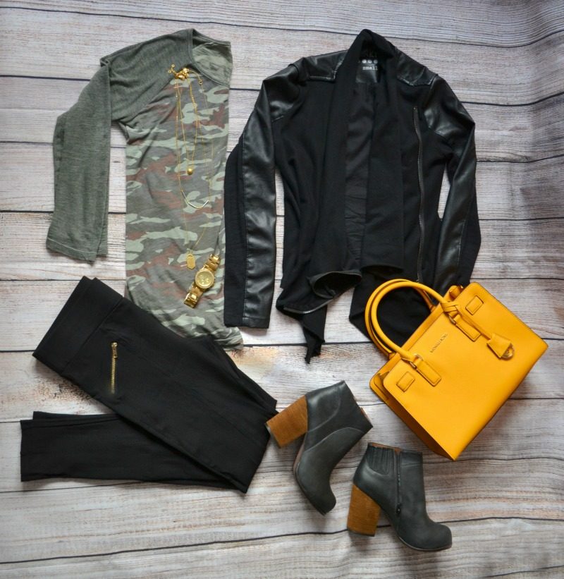 camouflage tee black vegan leather jacket black pants heeled booties yellow bag