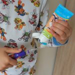putting Baby Brush Tutti-Frutti toohpaste on a KidzSonic electric toothbrush